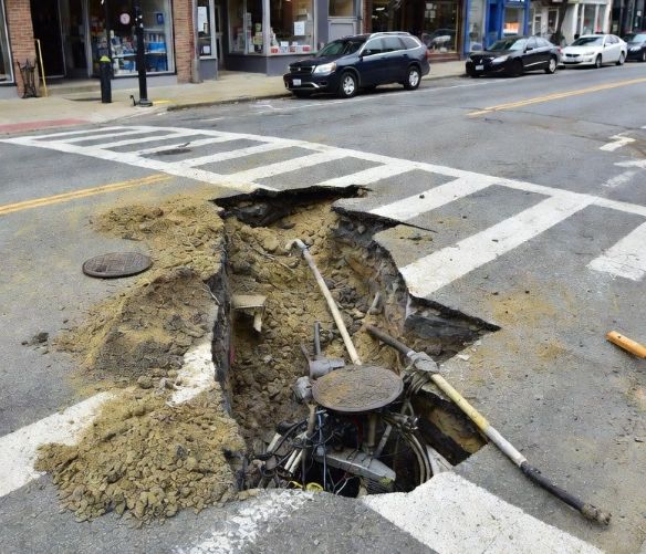 Urban street with minimal disruption while underground trenchless repair is taking place